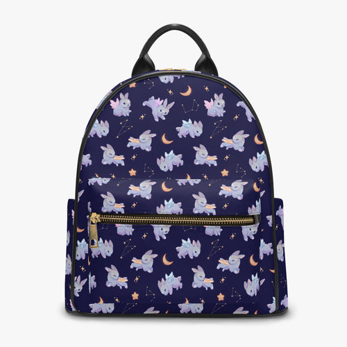 A dark blue purple mini leather backpack decorated in constellations, stars, moons and adorable whimsical bunnies