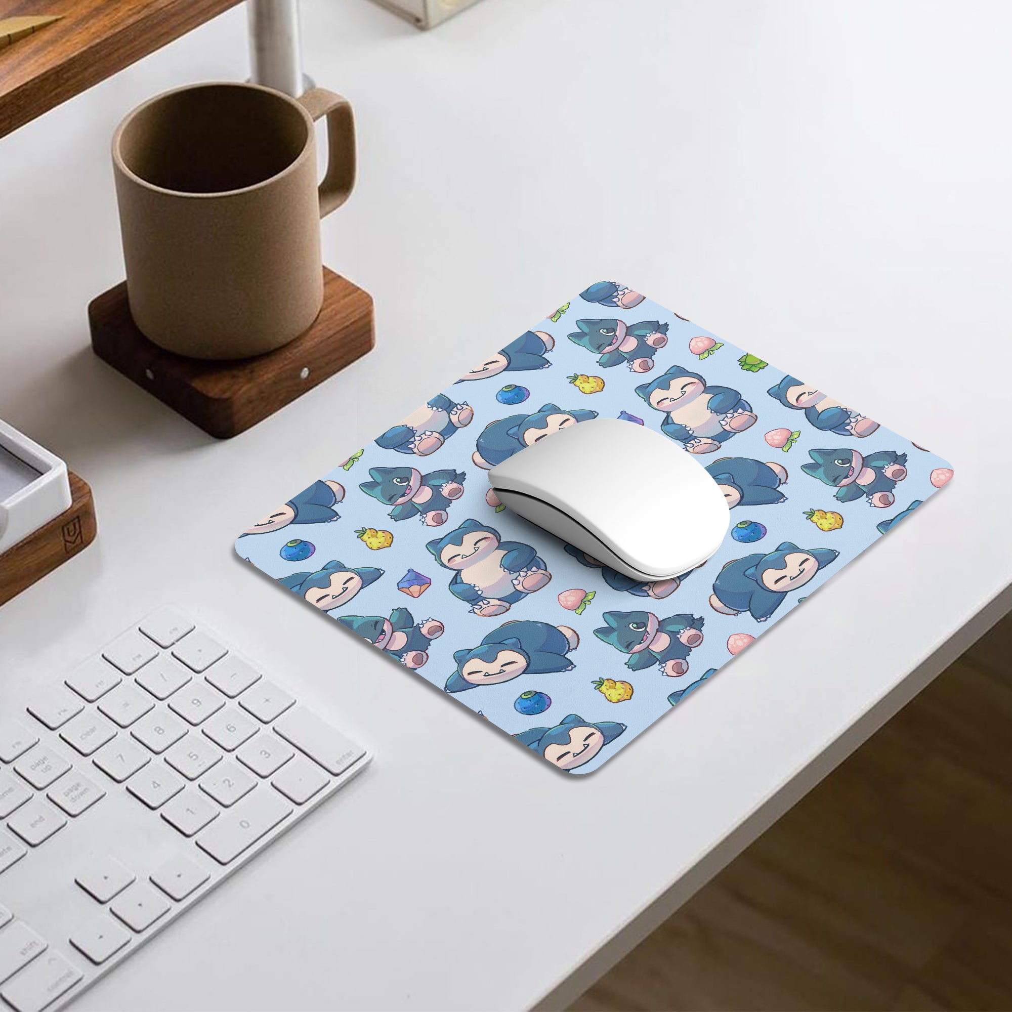 A light blue Snorlax and Munchlax Pokémon-themed gaming mouse pad for gaming and everyday office use. 