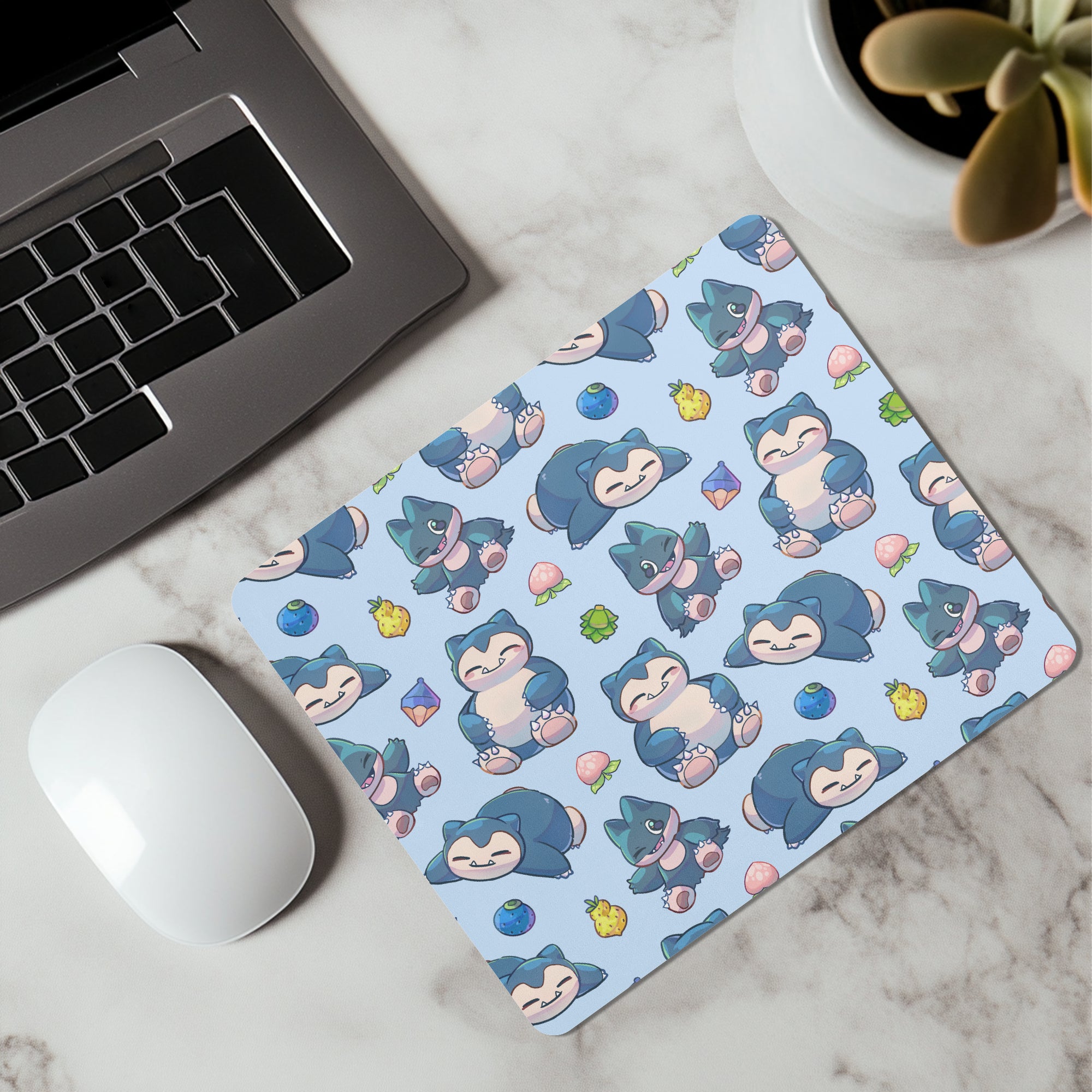 A light blue Snorlax and Munchlax Pokémon-themed gaming mouse pad for gaming and everyday office use. 