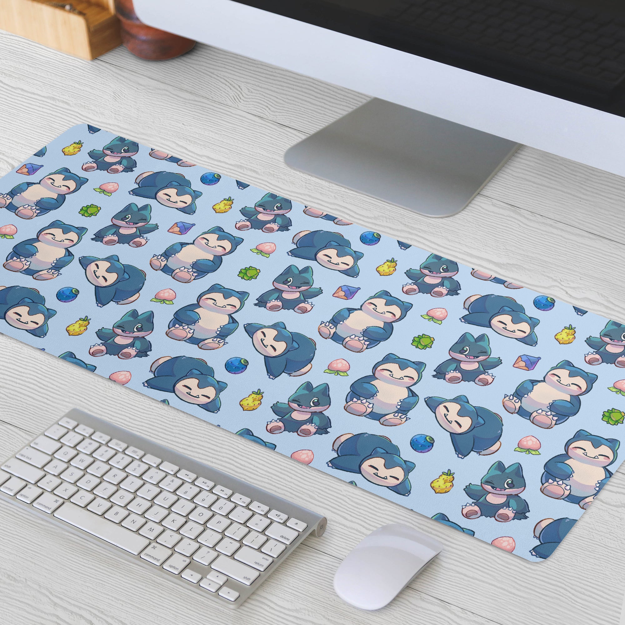 A large, light blue Snorlax and Munchlax Pokémon-themed gaming desk mat for gaming and everyday office use. 